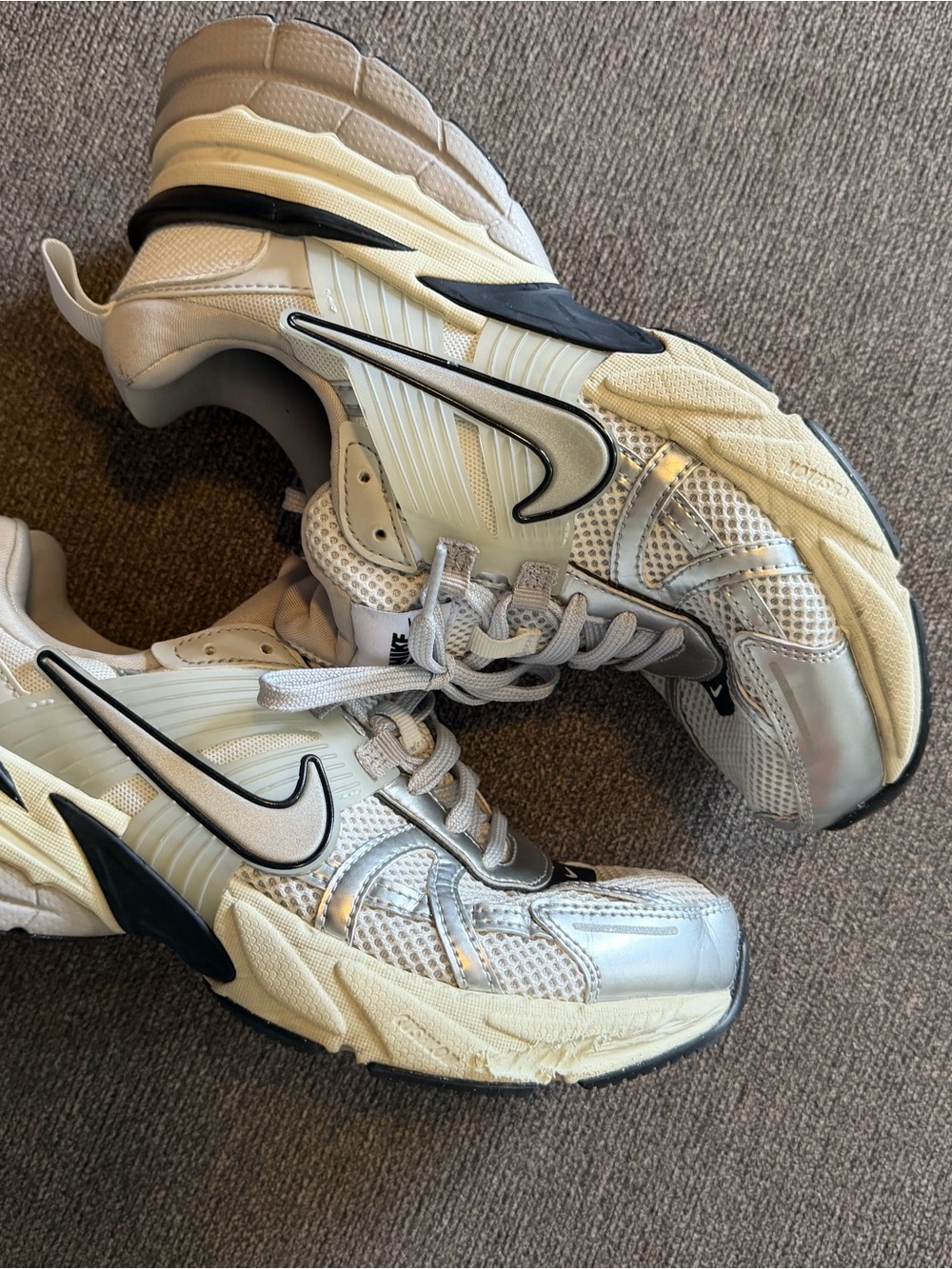 Nike women’s White Silver and Black Athletic Sneakers